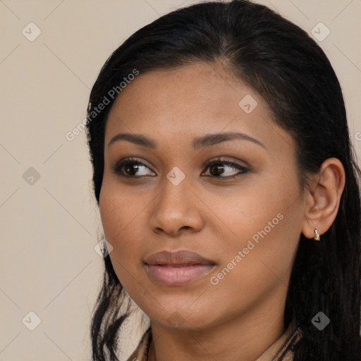 Joyful latino young-adult female with long  brown hair and brown eyes