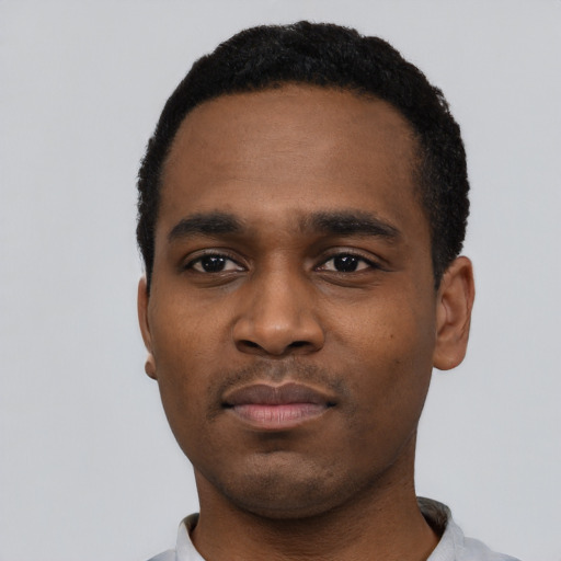 Neutral black young-adult male with short  black hair and brown eyes