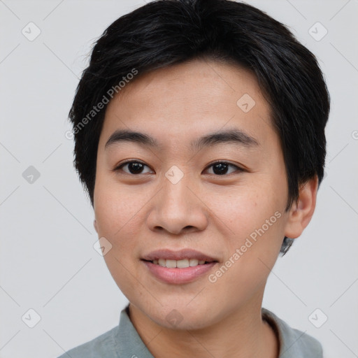 Joyful asian young-adult male with short  brown hair and brown eyes