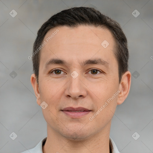 Joyful white adult male with short  brown hair and brown eyes