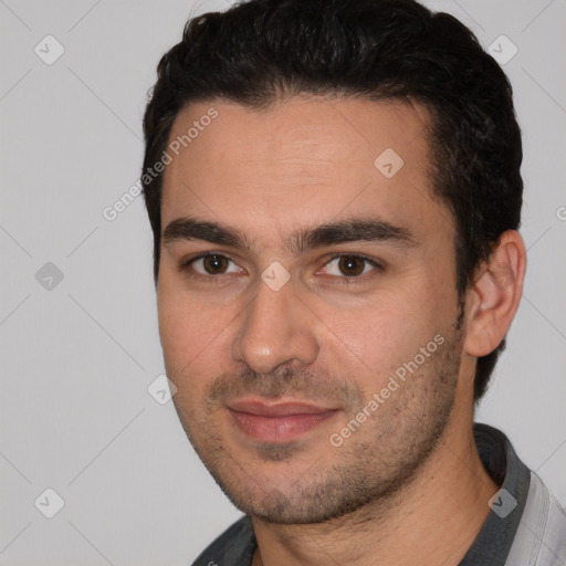 Joyful white young-adult male with short  black hair and brown eyes