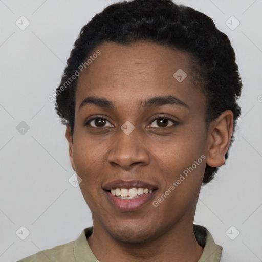 Joyful black young-adult female with short  black hair and brown eyes