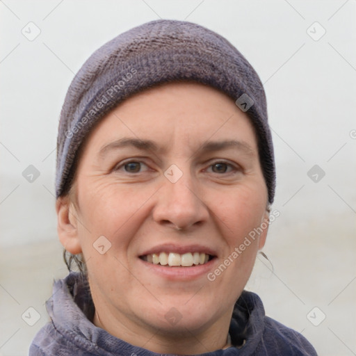 Joyful white adult female with short  brown hair and grey eyes