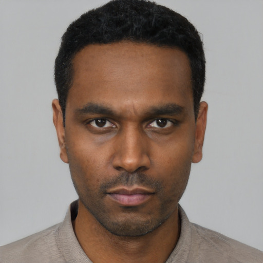 Neutral black young-adult male with short  black hair and brown eyes