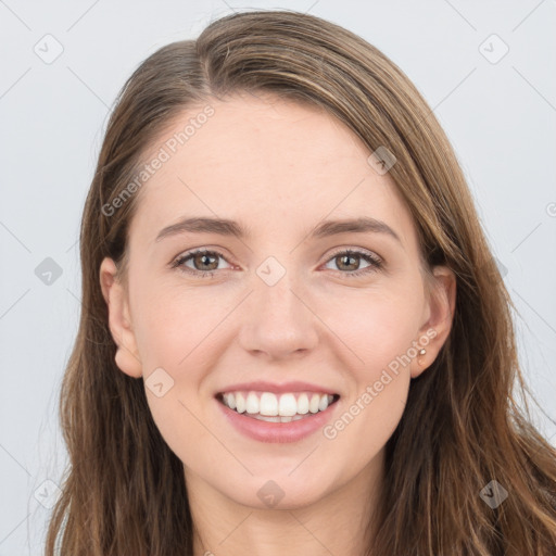 Joyful white young-adult female with long  brown hair and grey eyes