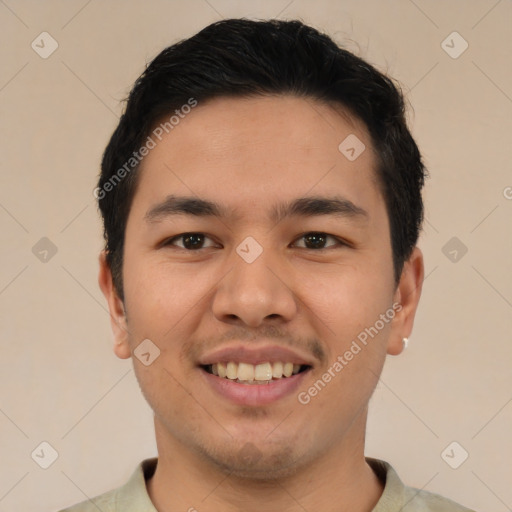 Joyful asian young-adult male with short  brown hair and brown eyes