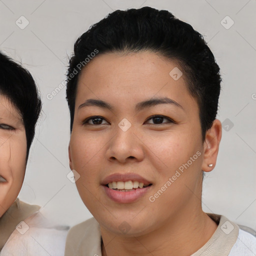 Joyful asian young-adult female with short  black hair and brown eyes