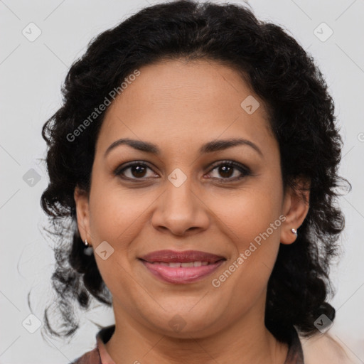 Joyful latino adult female with medium  brown hair and brown eyes