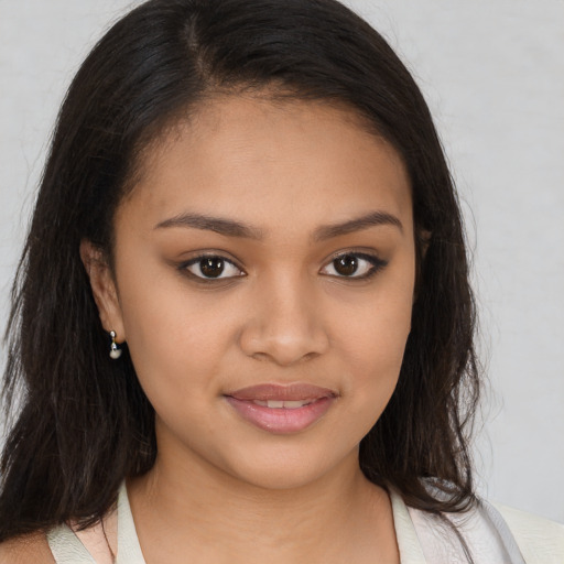 Joyful black young-adult female with medium  brown hair and brown eyes