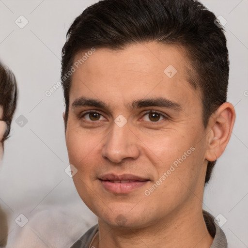 Joyful white young-adult male with short  brown hair and brown eyes