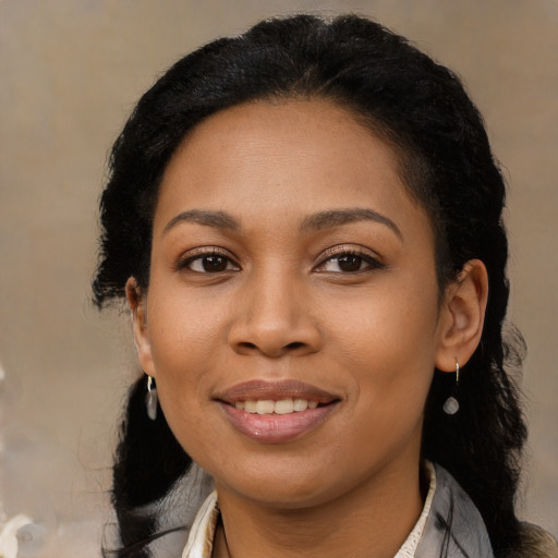 Joyful latino young-adult female with long  black hair and brown eyes