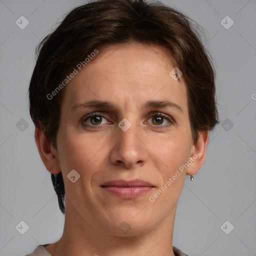 Joyful white adult female with short  brown hair and grey eyes