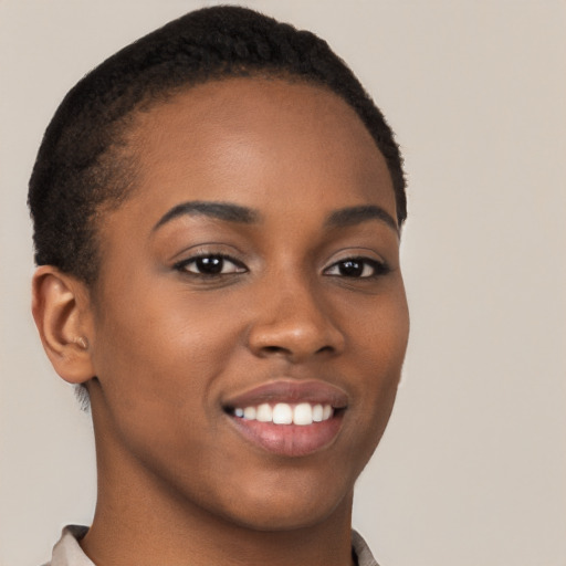 Joyful black young-adult female with short  brown hair and brown eyes