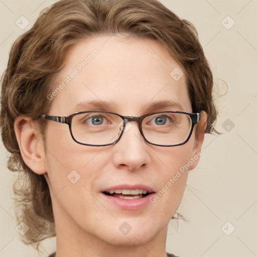 Joyful white adult female with medium  brown hair and blue eyes