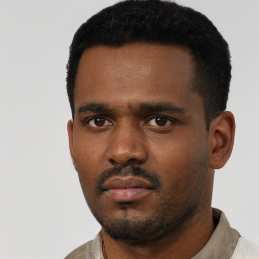 Neutral black young-adult male with short  black hair and brown eyes