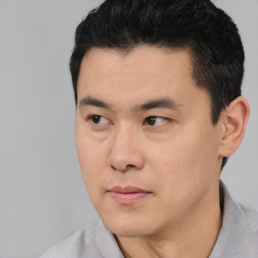 Neutral asian young-adult male with short  black hair and brown eyes