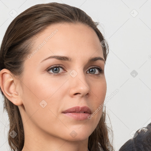 Neutral white young-adult female with long  brown hair and brown eyes