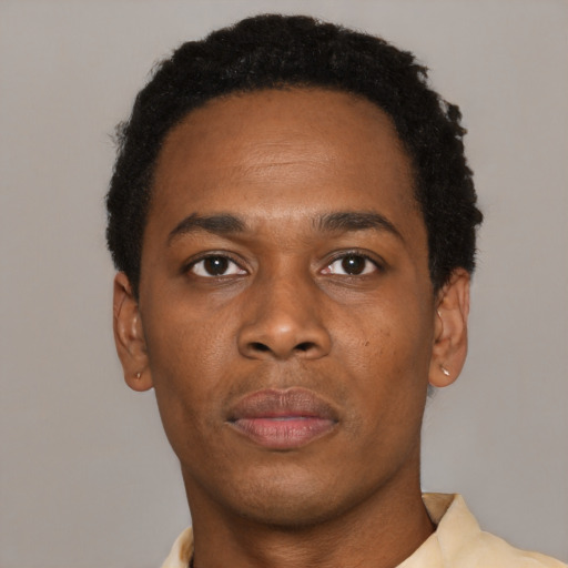 Neutral black young-adult male with short  black hair and brown eyes