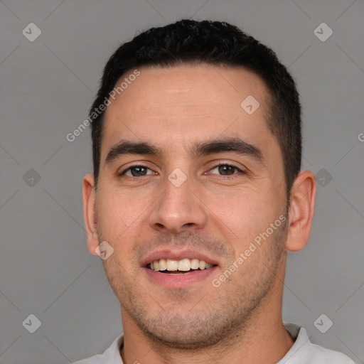 Joyful white young-adult male with short  black hair and brown eyes