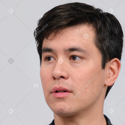 Neutral white young-adult male with short  black hair and brown eyes