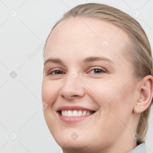 Joyful white young-adult female with medium  brown hair and blue eyes