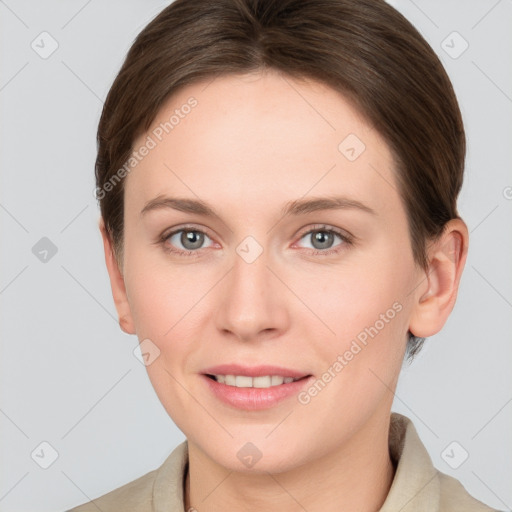 Joyful white young-adult female with short  brown hair and grey eyes