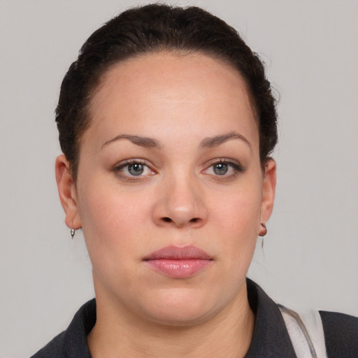 Neutral white young-adult female with short  brown hair and brown eyes