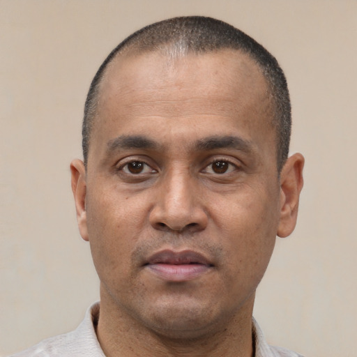 Neutral latino adult male with short  black hair and brown eyes