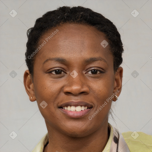 Joyful black young-adult female with short  brown hair and brown eyes