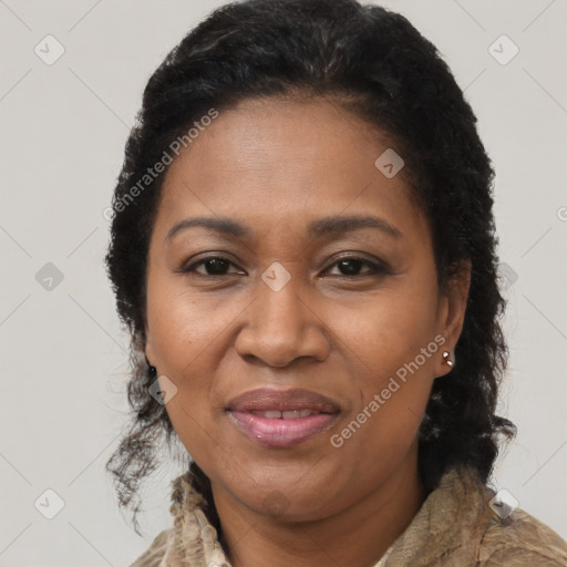 Joyful black adult female with medium  brown hair and brown eyes