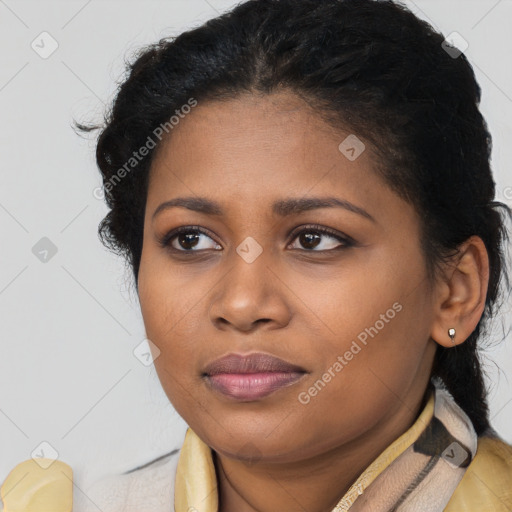 Joyful black young-adult female with long  brown hair and brown eyes