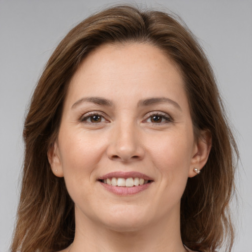 Joyful white young-adult female with medium  brown hair and brown eyes