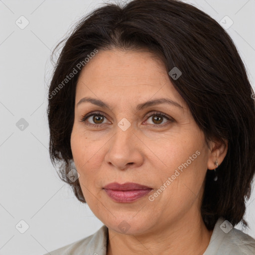 Joyful white adult female with medium  brown hair and brown eyes