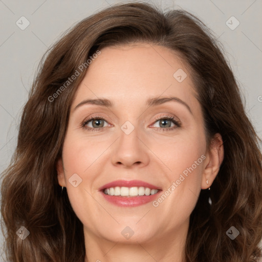 Joyful white adult female with medium  brown hair and green eyes