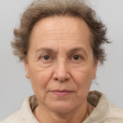 Joyful white middle-aged female with short  brown hair and brown eyes