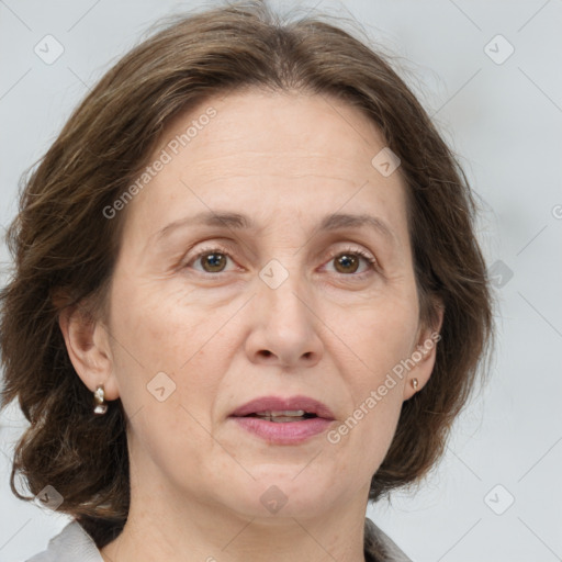 Joyful white adult female with medium  brown hair and grey eyes