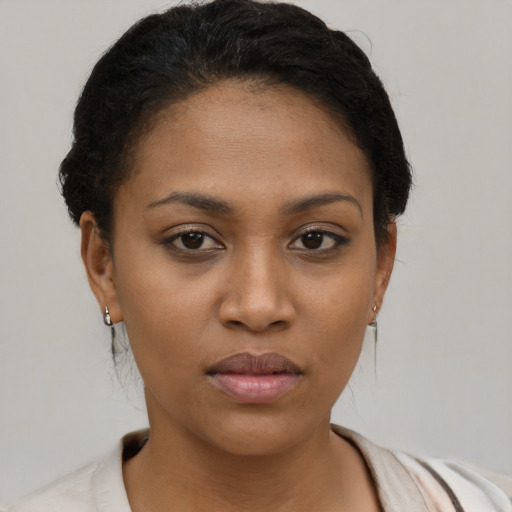 Neutral black young-adult female with short  brown hair and brown eyes
