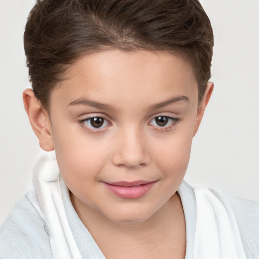 Joyful white child female with short  brown hair and brown eyes