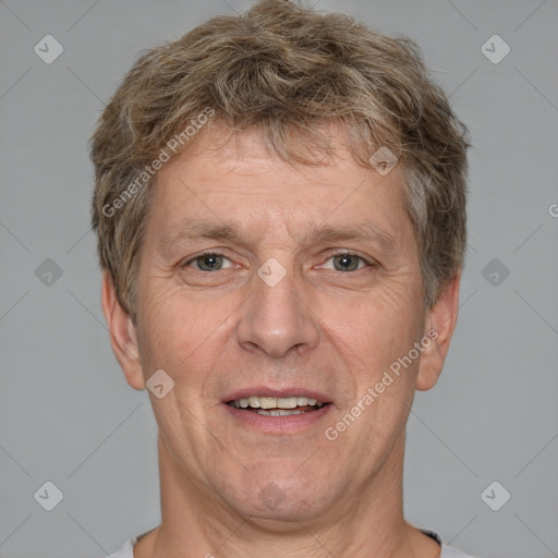 Joyful white adult male with short  brown hair and grey eyes