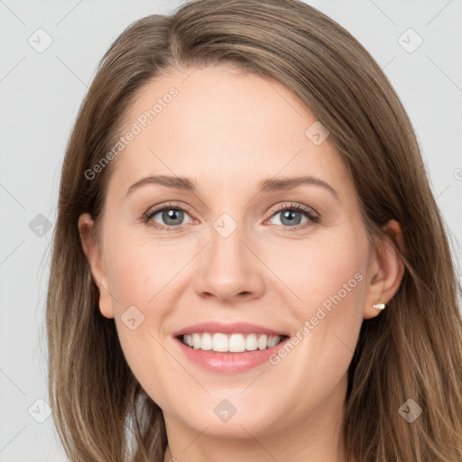 Joyful white young-adult female with long  brown hair and grey eyes