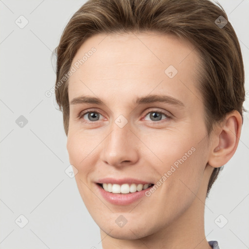 Joyful white young-adult female with short  brown hair and grey eyes