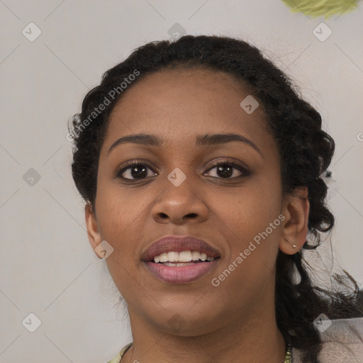 Joyful black young-adult female with medium  black hair and brown eyes