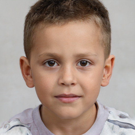 Joyful white child male with short  brown hair and brown eyes