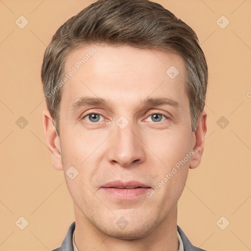 Joyful white young-adult male with short  brown hair and grey eyes