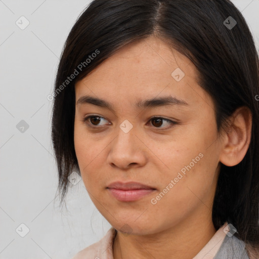 Joyful asian young-adult female with medium  brown hair and brown eyes