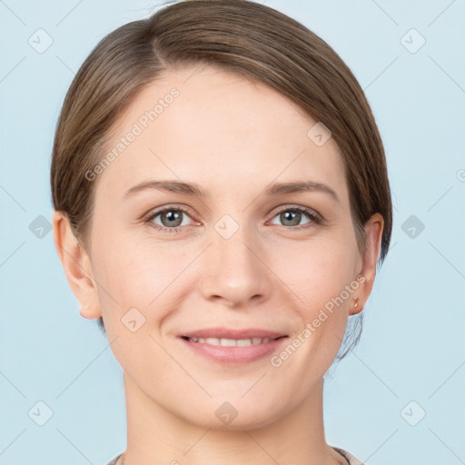 Joyful white young-adult female with short  brown hair and grey eyes