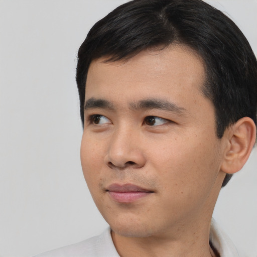 Neutral asian young-adult male with short  black hair and brown eyes