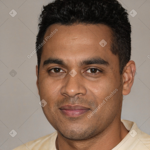 Joyful latino young-adult male with short  black hair and brown eyes