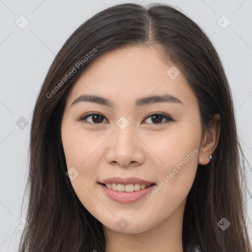 Joyful asian young-adult female with long  brown hair and brown eyes