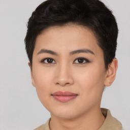 Joyful asian young-adult female with short  brown hair and brown eyes